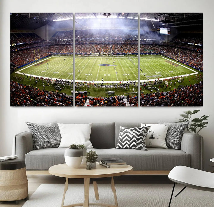 A living room features a striking piece of art on the wall, showcasing high-resolution printing on museum-quality canvas with "The University of Texas at San Antonio Roadrunners Football Team Print - San Antonio Alamodome Wall Art Canvas Print.