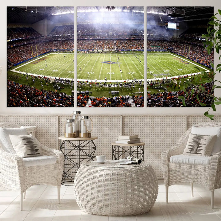 A living room features a striking piece of art on the wall, showcasing high-resolution printing on museum-quality canvas with "The University of Texas at San Antonio Roadrunners Football Team Print - San Antonio Alamodome Wall Art Canvas Print.