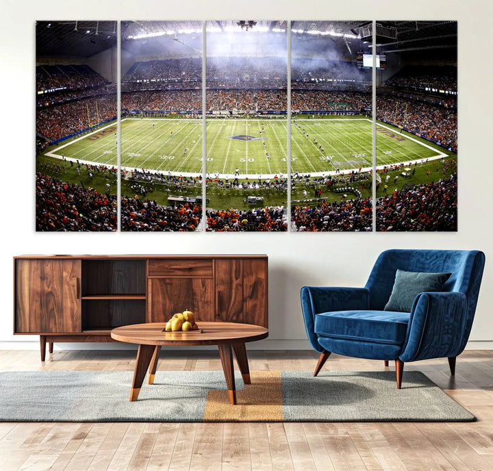 A living room features a striking piece of art on the wall, showcasing high-resolution printing on museum-quality canvas with "The University of Texas at San Antonio Roadrunners Football Team Print - San Antonio Alamodome Wall Art Canvas Print.