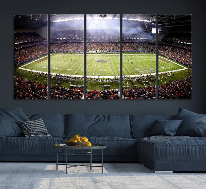 A living room features a striking piece of art on the wall, showcasing high-resolution printing on museum-quality canvas with "The University of Texas at San Antonio Roadrunners Football Team Print - San Antonio Alamodome Wall Art Canvas Print.