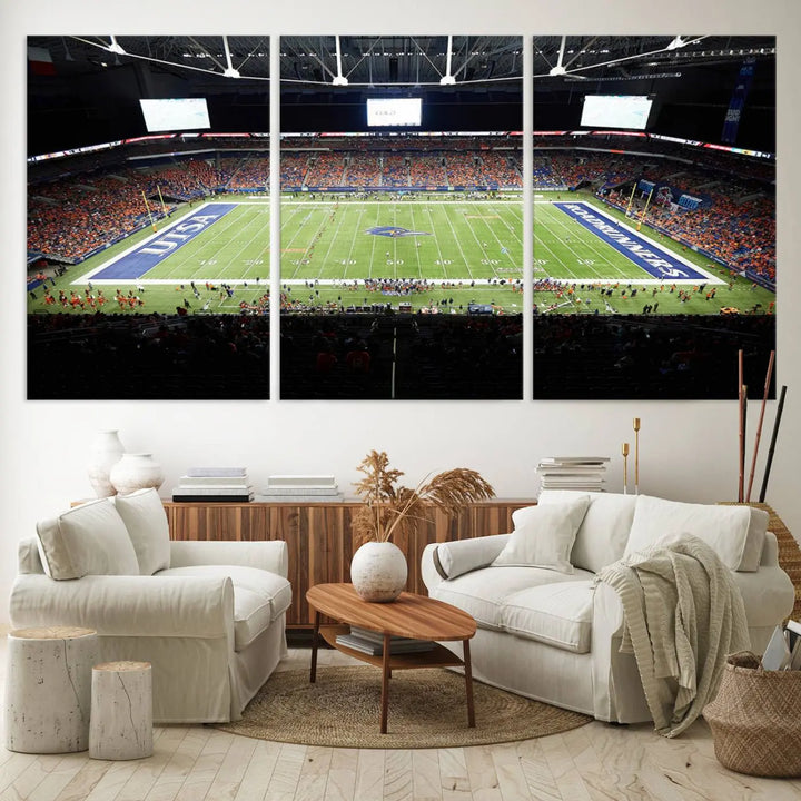 The living room features a large wall art of The University of Texas at San Antonio Roadrunners Football Team, capturing the vibrant atmosphere of the San Antonio Alamodome and printed with museum-quality precision.