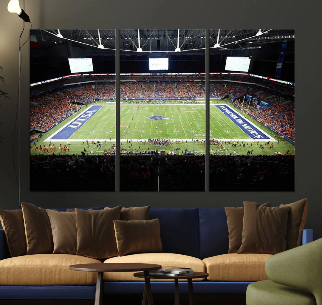 The living room features a large wall art of The University of Texas at San Antonio Roadrunners Football Team, capturing the vibrant atmosphere of the San Antonio Alamodome and printed with museum-quality precision.