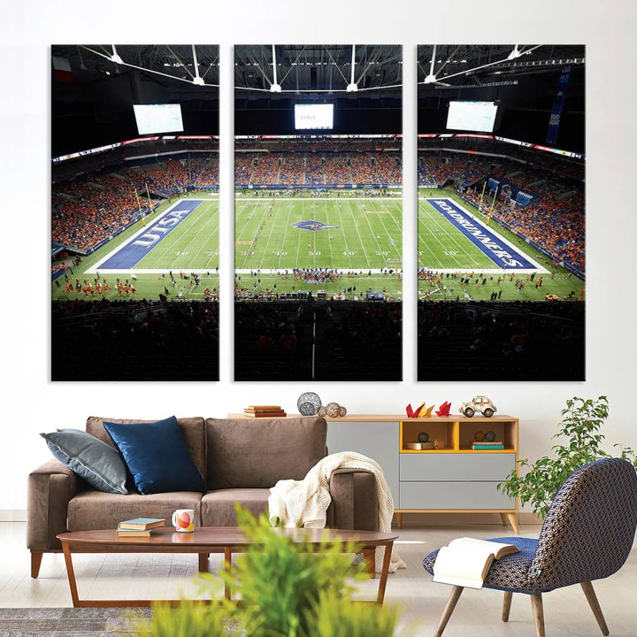 The living room features a large wall art of The University of Texas at San Antonio Roadrunners Football Team, capturing the vibrant atmosphere of the San Antonio Alamodome and printed with museum-quality precision.