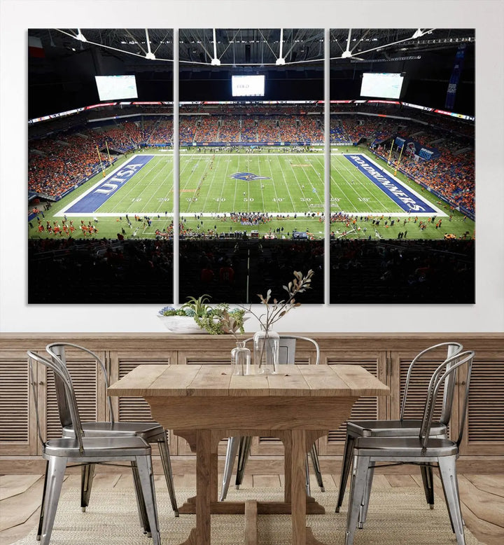 The living room features a large wall art of The University of Texas at San Antonio Roadrunners Football Team, capturing the vibrant atmosphere of the San Antonio Alamodome and printed with museum-quality precision.