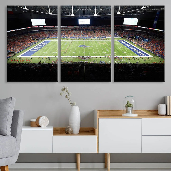 The living room features a large wall art of The University of Texas at San Antonio Roadrunners Football Team, capturing the vibrant atmosphere of the San Antonio Alamodome and printed with museum-quality precision.