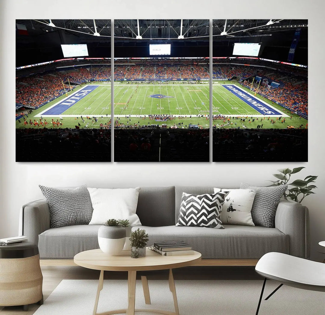 The living room features a large wall art of The University of Texas at San Antonio Roadrunners Football Team, capturing the vibrant atmosphere of the San Antonio Alamodome and printed with museum-quality precision.