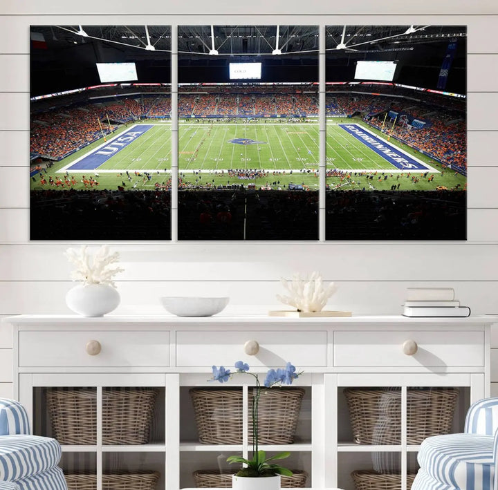 The living room features a large wall art of The University of Texas at San Antonio Roadrunners Football Team, capturing the vibrant atmosphere of the San Antonio Alamodome and printed with museum-quality precision.