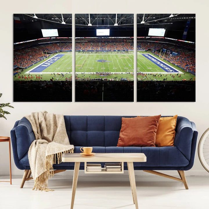 The living room features a large wall art of The University of Texas at San Antonio Roadrunners Football Team, capturing the vibrant atmosphere of the San Antonio Alamodome and printed with museum-quality precision.