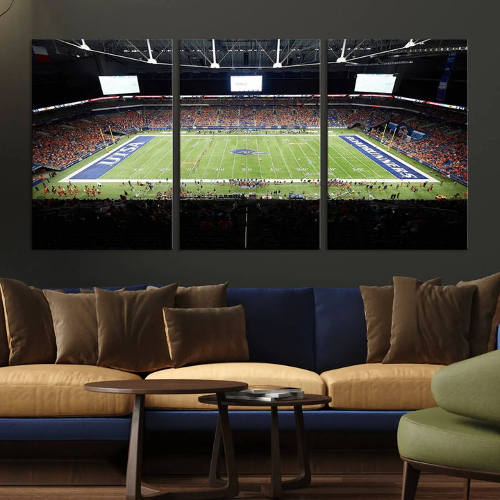 The living room features a large wall art of The University of Texas at San Antonio Roadrunners Football Team, capturing the vibrant atmosphere of the San Antonio Alamodome and printed with museum-quality precision.