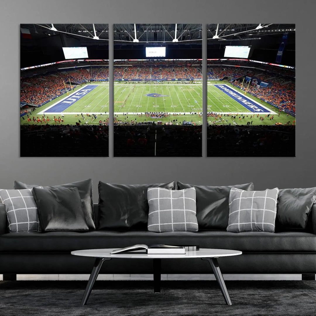 The living room features a large wall art of The University of Texas at San Antonio Roadrunners Football Team, capturing the vibrant atmosphere of the San Antonio Alamodome and printed with museum-quality precision.