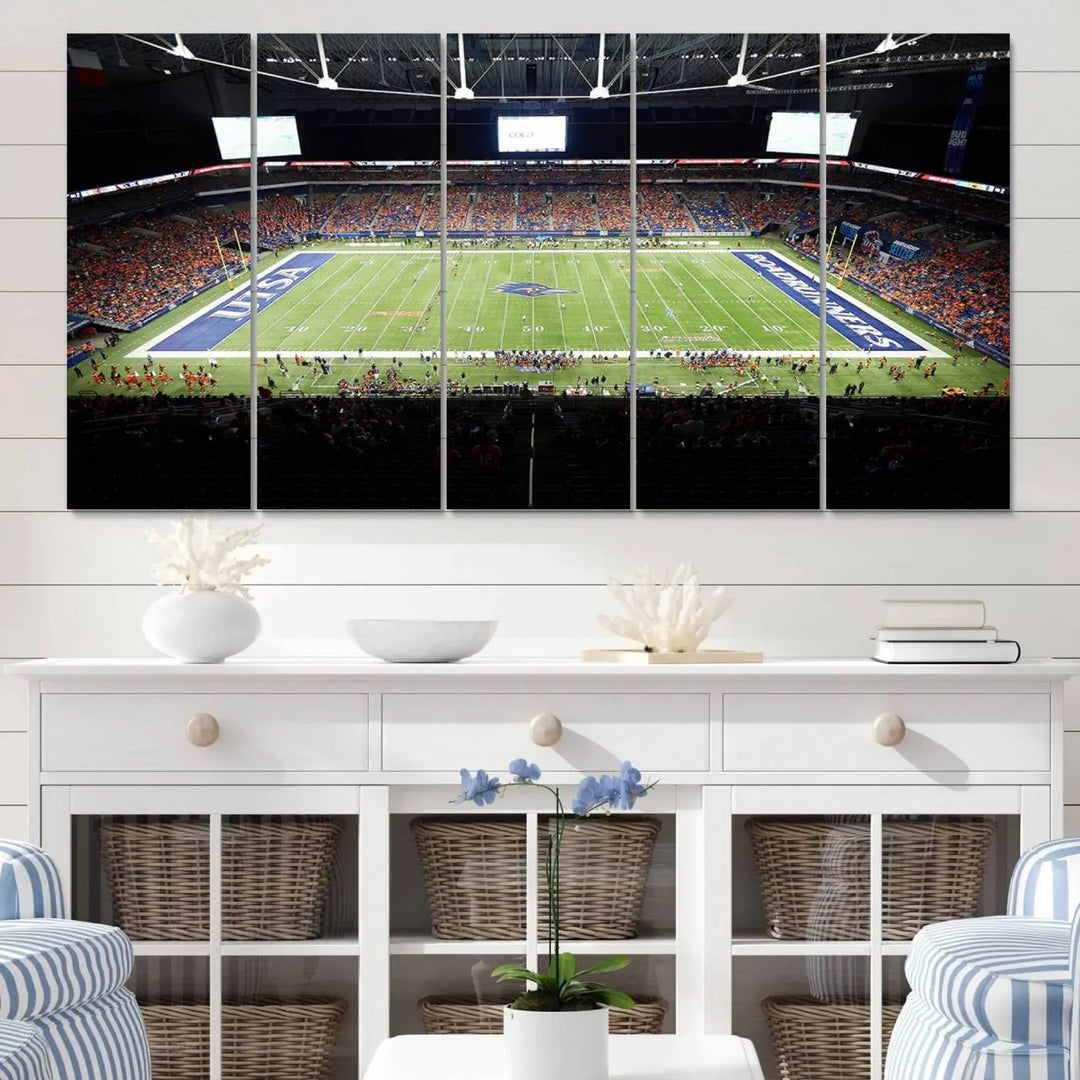 The living room features a large wall art of The University of Texas at San Antonio Roadrunners Football Team, capturing the vibrant atmosphere of the San Antonio Alamodome and printed with museum-quality precision.