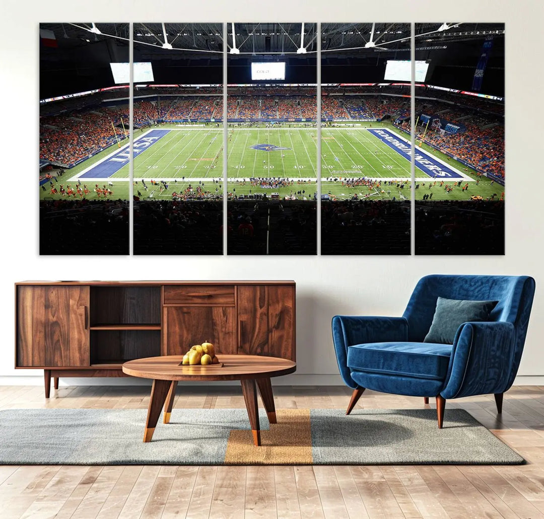 The living room features a large wall art of The University of Texas at San Antonio Roadrunners Football Team, capturing the vibrant atmosphere of the San Antonio Alamodome and printed with museum-quality precision.