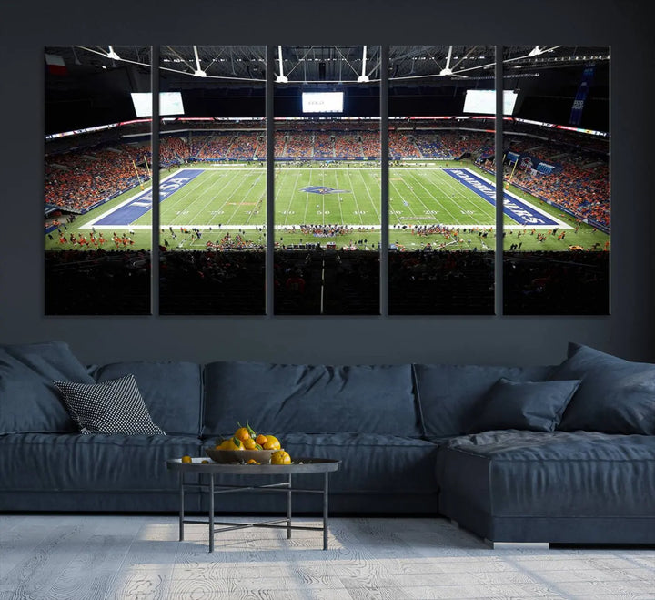 The living room features a large wall art of The University of Texas at San Antonio Roadrunners Football Team, capturing the vibrant atmosphere of the San Antonio Alamodome and printed with museum-quality precision.