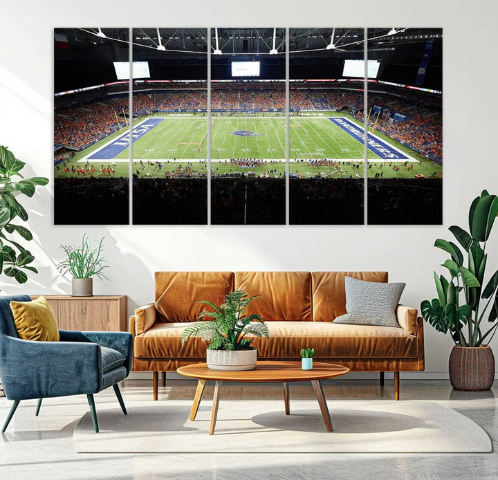 The living room features a large wall art of The University of Texas at San Antonio Roadrunners Football Team, capturing the vibrant atmosphere of the San Antonio Alamodome and printed with museum-quality precision.