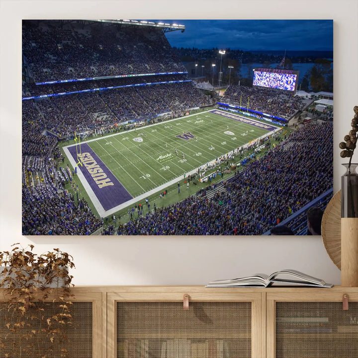 The living room features The University of Washington Huskies Football Team Print, showcasing a vibrant triptych of Seattle's Husky Stadium above the couch. This dynamic artwork is elegantly balanced by subtle animal portrait art, creating an inviting ambiance.