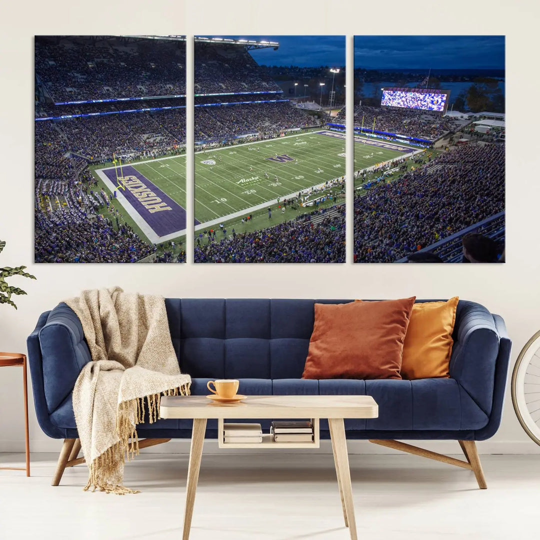 The living room features The University of Washington Huskies Football Team Print, showcasing a vibrant triptych of Seattle's Husky Stadium above the couch. This dynamic artwork is elegantly balanced by subtle animal portrait art, creating an inviting ambiance.