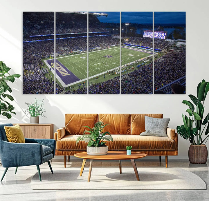 The living room features The University of Washington Huskies Football Team Print, showcasing a vibrant triptych of Seattle's Husky Stadium above the couch. This dynamic artwork is elegantly balanced by subtle animal portrait art, creating an inviting ambiance.