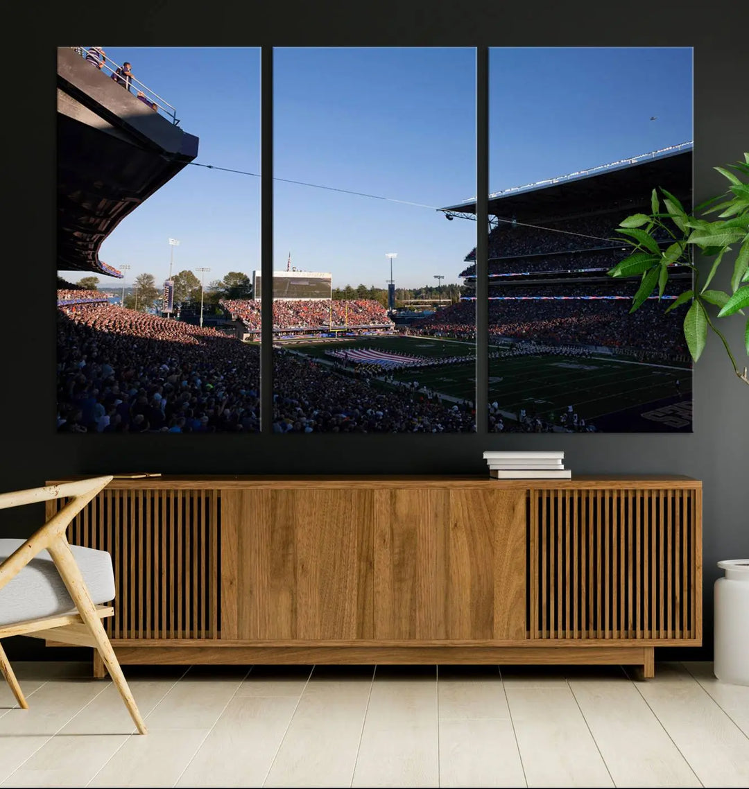 The living room features a triptych wall art showcasing "The University of Washington Huskies Football Team Print - Seattle Husky Stadium Wall Art Canvas Print," capturing a husky and stadium scene during an exhilarating sports event.