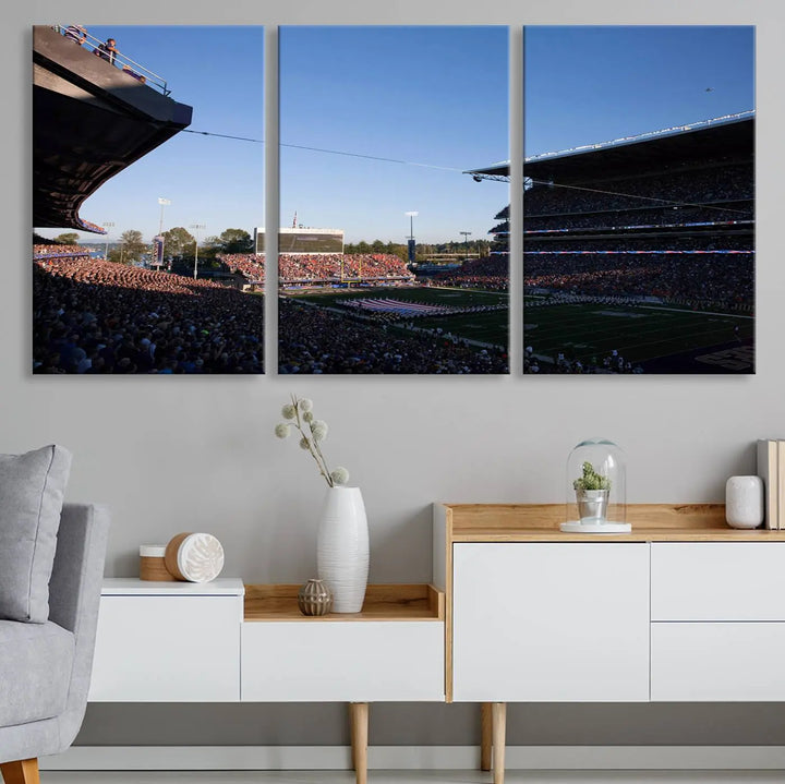 The living room features a triptych wall art showcasing "The University of Washington Huskies Football Team Print - Seattle Husky Stadium Wall Art Canvas Print," capturing a husky and stadium scene during an exhilarating sports event.