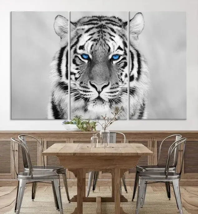 A striking triptych titled "Tiger Canvas Artwork Wall Art Print" showcases a white tiger with captivating blue eyes. This museum-quality, gallery-wrapped canvas stands out elegantly on its own, crafting a sophisticated visual experience.