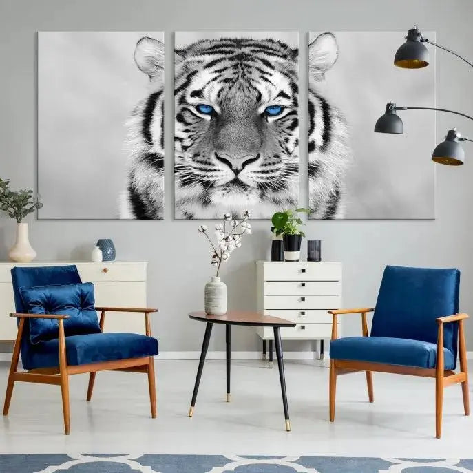 A striking triptych titled "Tiger Canvas Artwork Wall Art Print" showcases a white tiger with captivating blue eyes. This museum-quality, gallery-wrapped canvas stands out elegantly on its own, crafting a sophisticated visual experience.