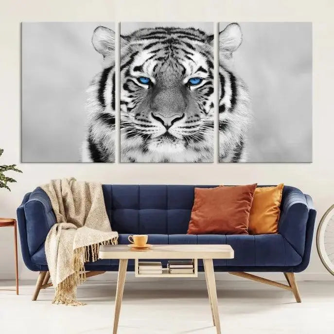 A striking triptych titled "Tiger Canvas Artwork Wall Art Print" showcases a white tiger with captivating blue eyes. This museum-quality, gallery-wrapped canvas stands out elegantly on its own, crafting a sophisticated visual experience.