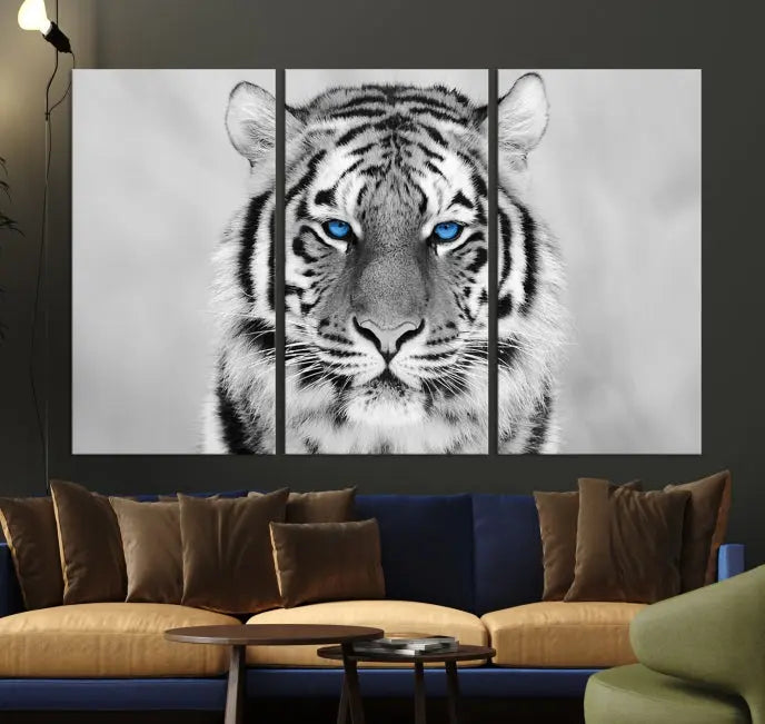 A striking triptych titled "Tiger Canvas Artwork Wall Art Print" showcases a white tiger with captivating blue eyes. This museum-quality, gallery-wrapped canvas stands out elegantly on its own, crafting a sophisticated visual experience.