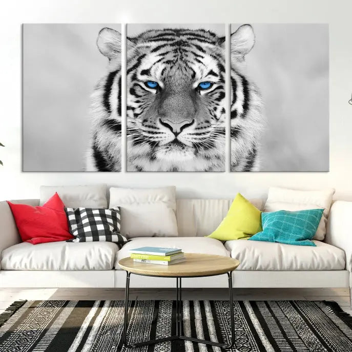 A striking triptych titled "Tiger Canvas Artwork Wall Art Print" showcases a white tiger with captivating blue eyes. This museum-quality, gallery-wrapped canvas stands out elegantly on its own, crafting a sophisticated visual experience.