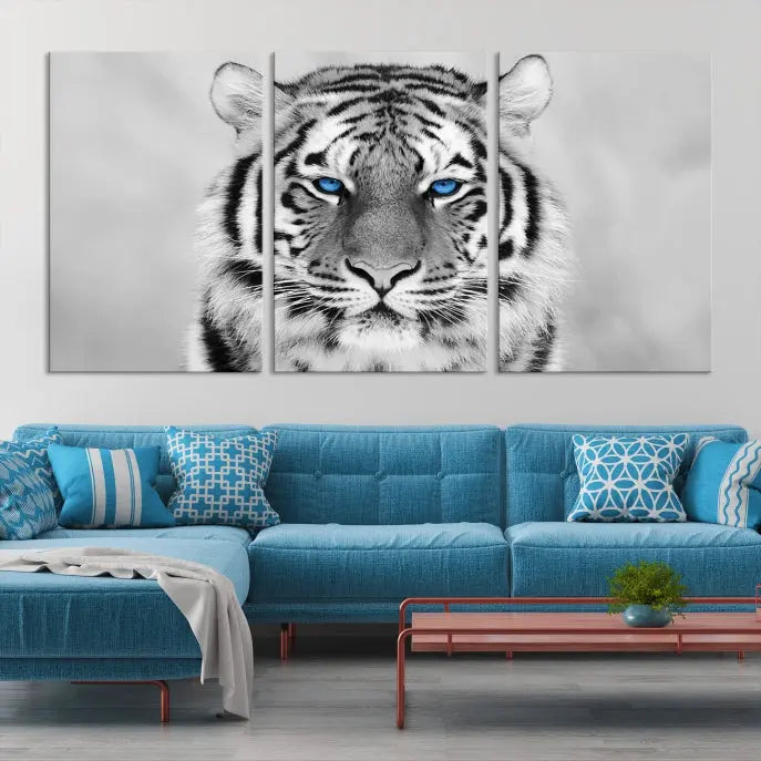 A striking triptych titled "Tiger Canvas Artwork Wall Art Print" showcases a white tiger with captivating blue eyes. This museum-quality, gallery-wrapped canvas stands out elegantly on its own, crafting a sophisticated visual experience.