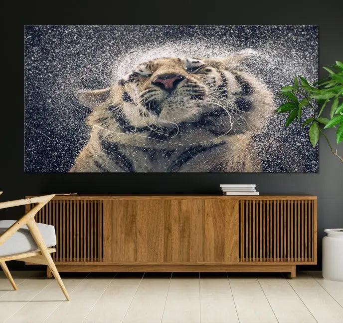 The "Tiger and Rain Canvas Print," featuring a triptych design of a tiger shaking off water, is printed on museum-quality canvas with gallery-wrapped edges.