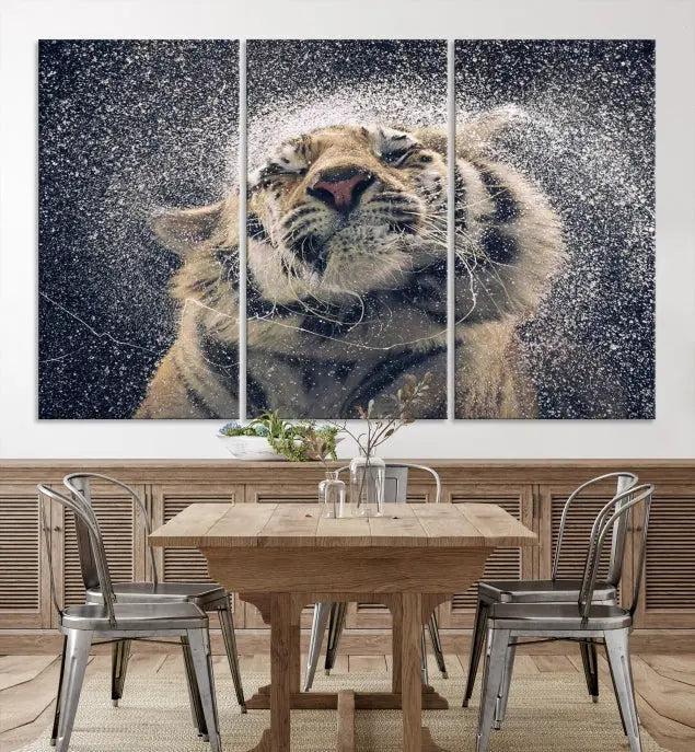 The "Tiger and Rain Canvas Print," featuring a triptych design of a tiger shaking off water, is printed on museum-quality canvas with gallery-wrapped edges.