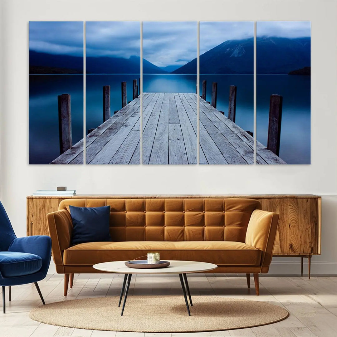 Tranquil lakeside pier triptych canvas art featuring a blue mountain horizon and serene dock. Perfect for modern interiors. High-quality giclee canvas print.