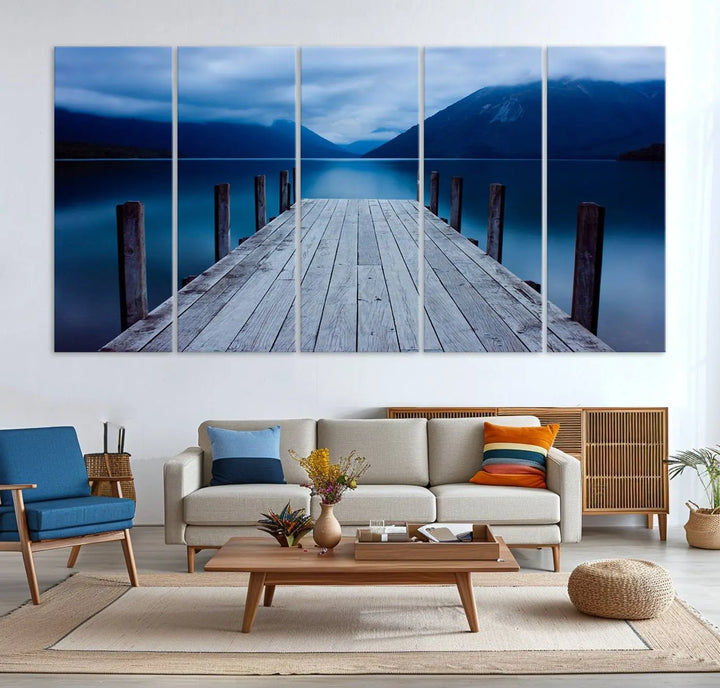 Tranquil lakeside pier triptych canvas art featuring a blue mountain horizon and serene dock. Perfect for modern interiors. High-quality giclee canvas print.