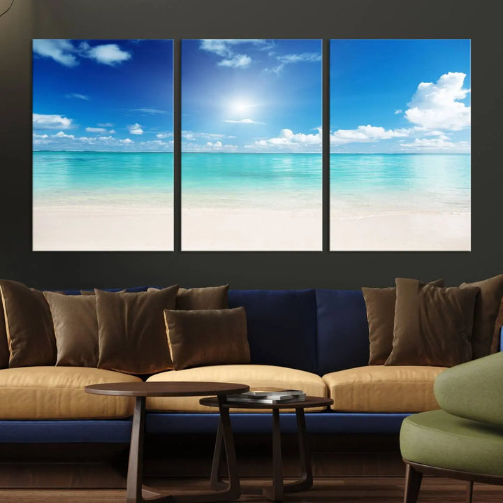 A serene living room is adorned with beach-themed artwork, featuring the Tranquil Ocean Paradise Triptych Wall Art that creates a soothing atmosphere. The neutral decor perfectly enhances the coastal retreat ambiance.