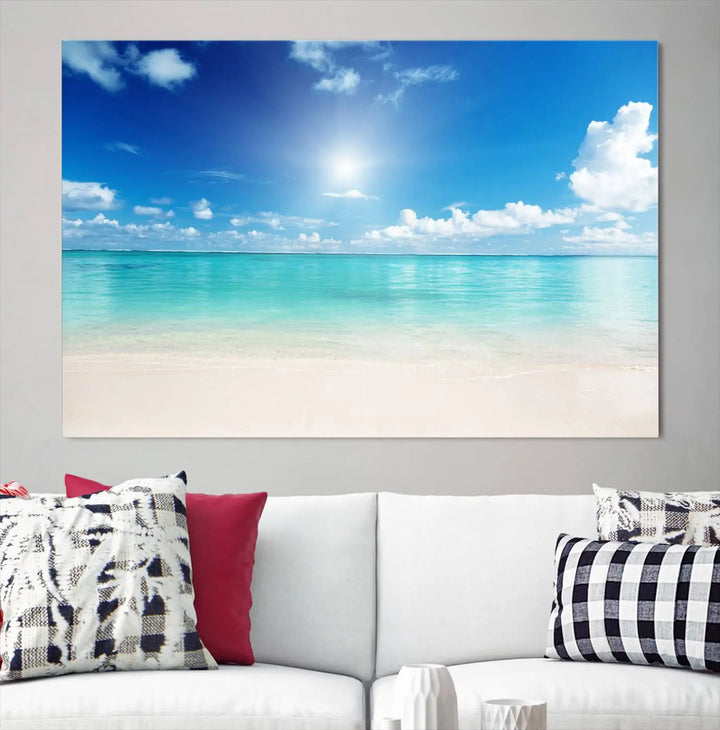 A serene living room is adorned with beach-themed artwork, featuring the Tranquil Ocean Paradise Triptych Wall Art that creates a soothing atmosphere. The neutral decor perfectly enhances the coastal retreat ambiance.