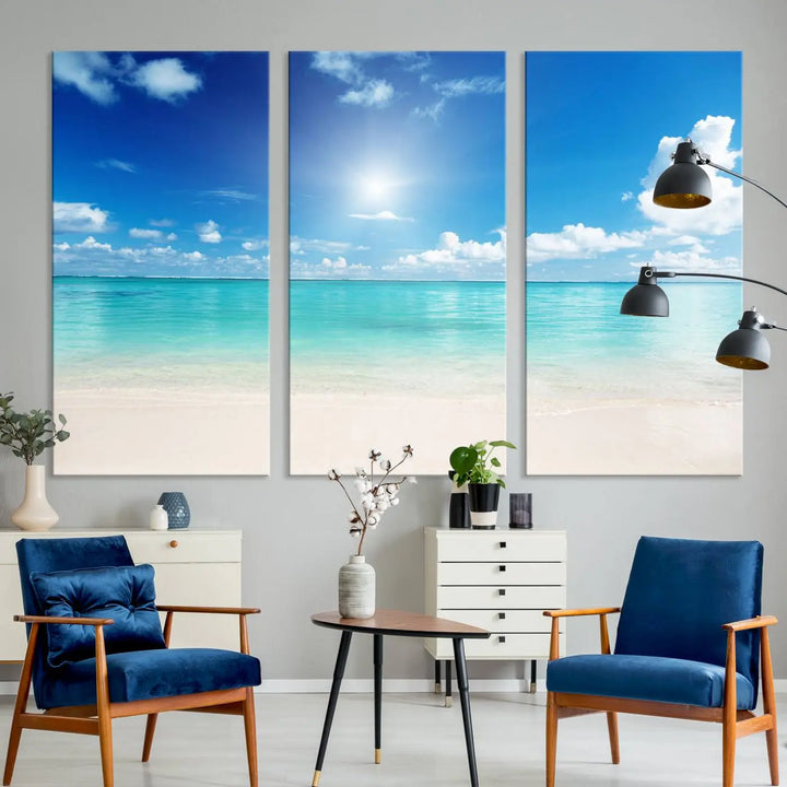 A serene living room is adorned with beach-themed artwork, featuring the Tranquil Ocean Paradise Triptych Wall Art that creates a soothing atmosphere. The neutral decor perfectly enhances the coastal retreat ambiance.