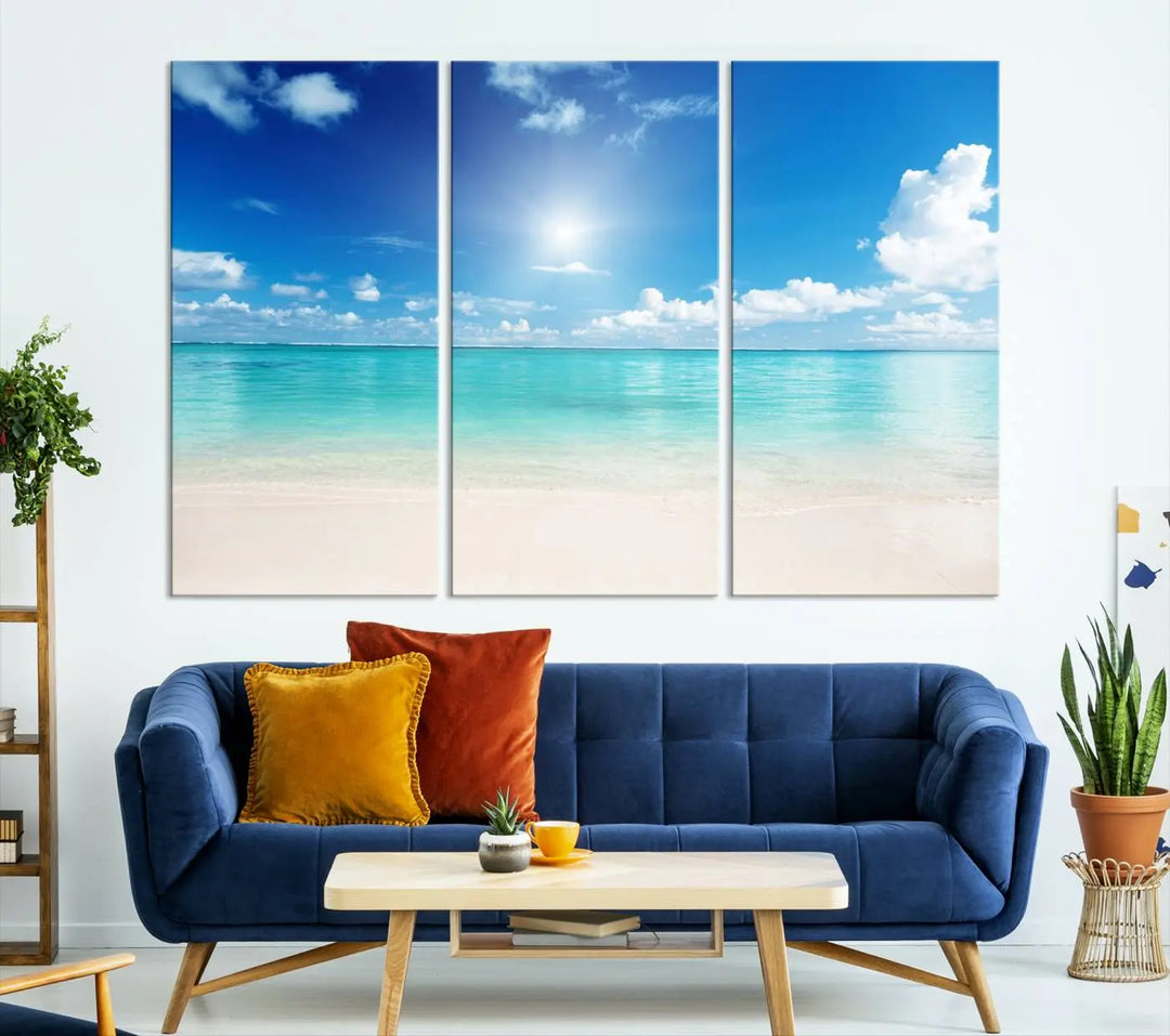 A serene living room is adorned with beach-themed artwork, featuring the Tranquil Ocean Paradise Triptych Wall Art that creates a soothing atmosphere. The neutral decor perfectly enhances the coastal retreat ambiance.