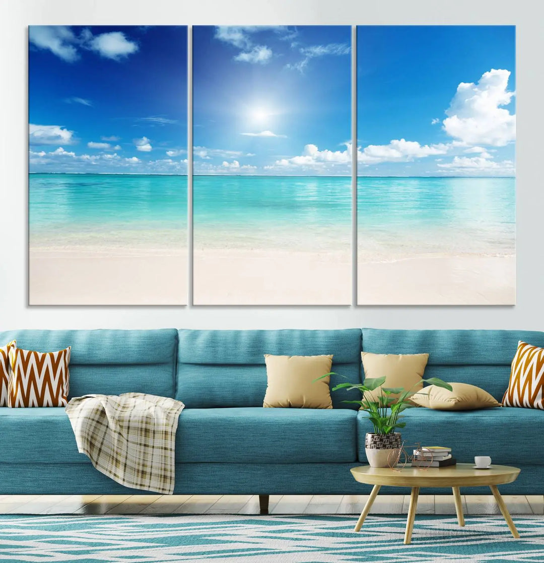 A serene living room is adorned with beach-themed artwork, featuring the Tranquil Ocean Paradise Triptych Wall Art that creates a soothing atmosphere. The neutral decor perfectly enhances the coastal retreat ambiance.