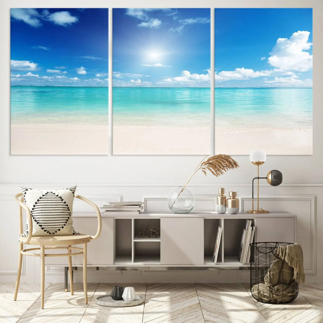 A serene living room is adorned with beach-themed artwork, featuring the Tranquil Ocean Paradise Triptych Wall Art that creates a soothing atmosphere. The neutral decor perfectly enhances the coastal retreat ambiance.