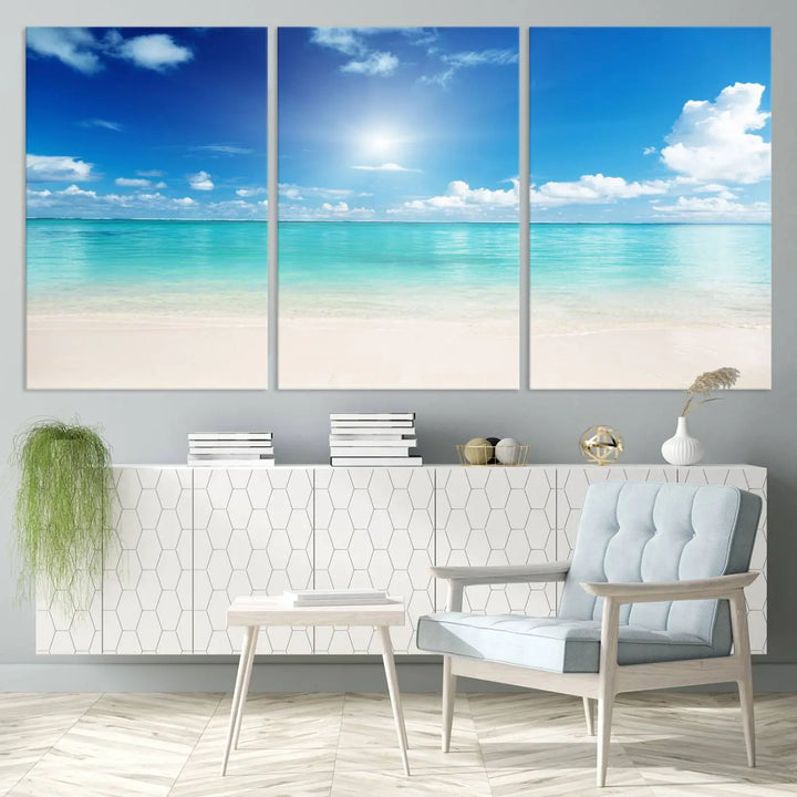 A serene living room is adorned with beach-themed artwork, featuring the Tranquil Ocean Paradise Triptych Wall Art that creates a soothing atmosphere. The neutral decor perfectly enhances the coastal retreat ambiance.