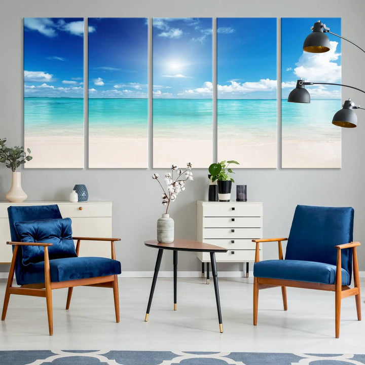 A serene living room is adorned with beach-themed artwork, featuring the Tranquil Ocean Paradise Triptych Wall Art that creates a soothing atmosphere. The neutral decor perfectly enhances the coastal retreat ambiance.