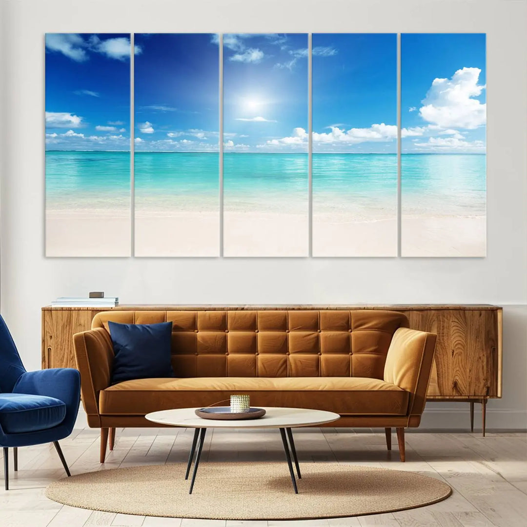 A serene living room is adorned with beach-themed artwork, featuring the Tranquil Ocean Paradise Triptych Wall Art that creates a soothing atmosphere. The neutral decor perfectly enhances the coastal retreat ambiance.