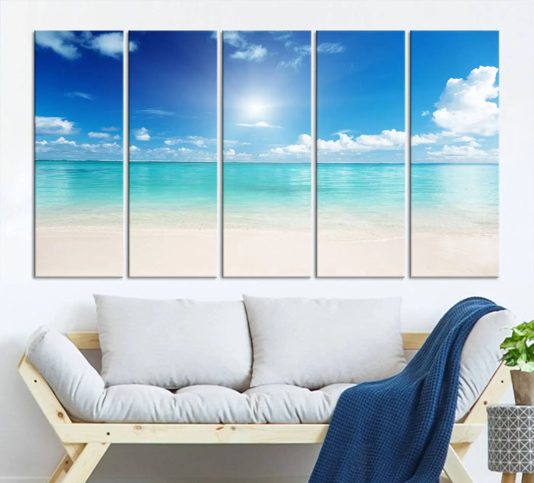 A serene living room is adorned with beach-themed artwork, featuring the Tranquil Ocean Paradise Triptych Wall Art that creates a soothing atmosphere. The neutral decor perfectly enhances the coastal retreat ambiance.