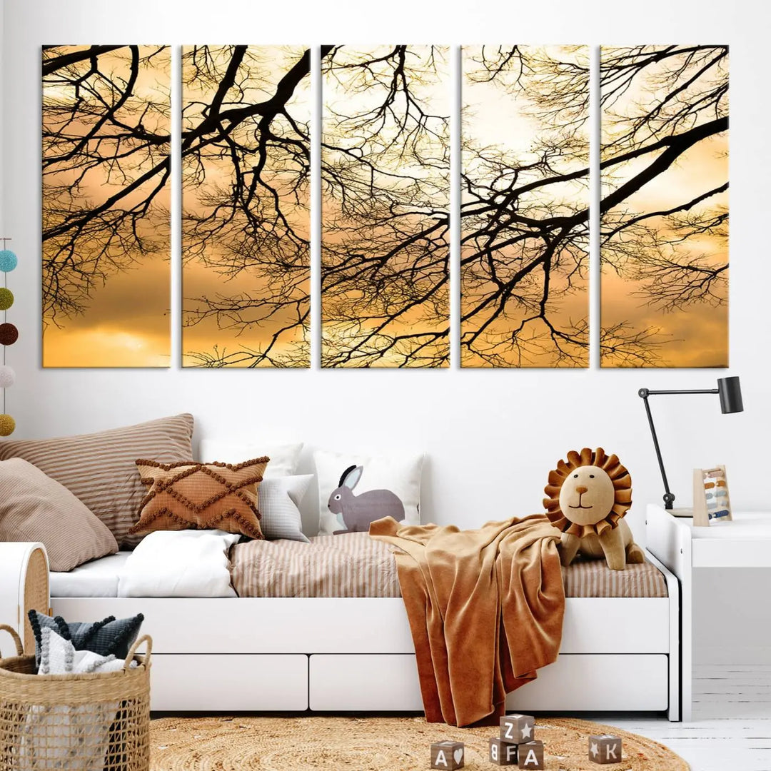 The Tree Branch Wall Art Canvas Print is a triptych depicting tree branches against an orange sky, printed on museum-quality canvases. Each piece comes ready to hang, offering both style and convenience.