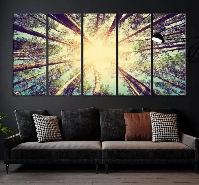 The "Tree and Sunshine" canvas print, depicting towering trees viewed from below with sunlight filtering through, is crafted on museum-quality canvas. Each piece is gallery wrapped and features a UV-protective coating to maintain its vibrant hues.