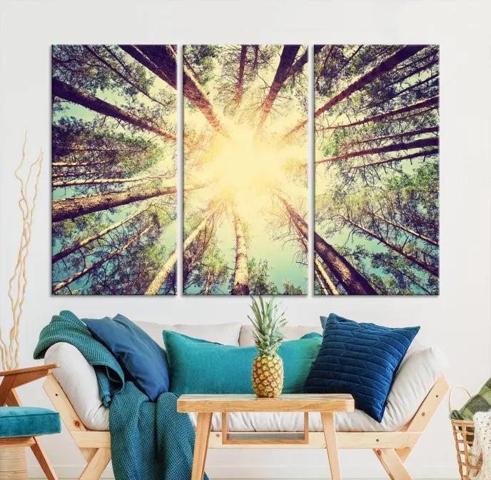 The "Tree and Sunshine" canvas print, depicting towering trees viewed from below with sunlight filtering through, is crafted on museum-quality canvas. Each piece is gallery wrapped and features a UV-protective coating to maintain its vibrant hues.