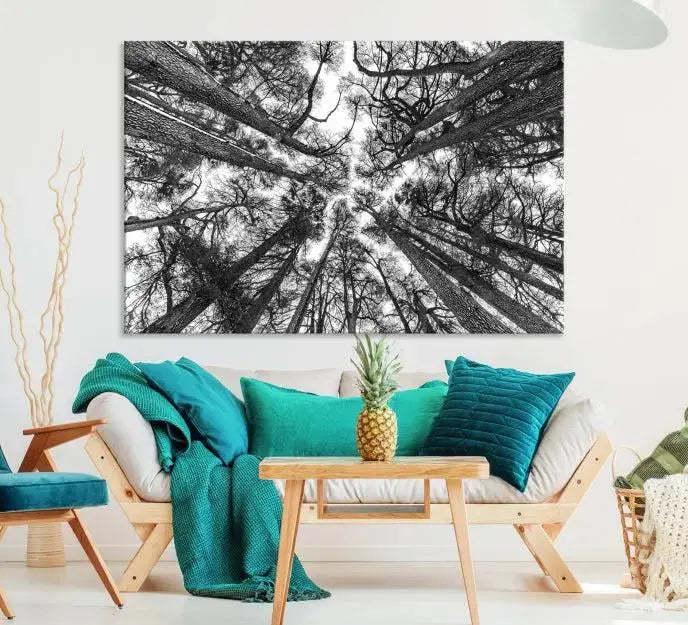 The "Trees Contemporary Art Canvas Print" is a striking black and white triptych featuring tall trees viewed from below. This artwork is gallery wrapped on museum-quality canvas, complete with a UV-protective coating to ensure its longevity.