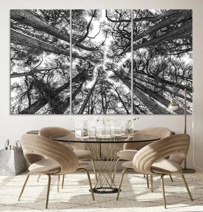 The "Trees Contemporary Art Canvas Print" is a striking black and white triptych featuring tall trees viewed from below. This artwork is gallery wrapped on museum-quality canvas, complete with a UV-protective coating to ensure its longevity.