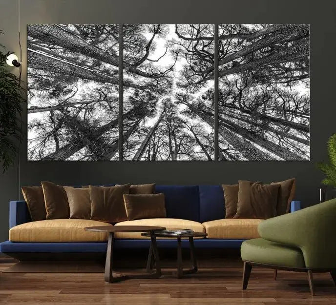 The "Trees Contemporary Art Canvas Print" is a striking black and white triptych featuring tall trees viewed from below. This artwork is gallery wrapped on museum-quality canvas, complete with a UV-protective coating to ensure its longevity.