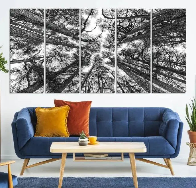 The "Trees Contemporary Art Canvas Print" is a striking black and white triptych featuring tall trees viewed from below. This artwork is gallery wrapped on museum-quality canvas, complete with a UV-protective coating to ensure its longevity.